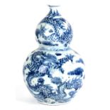 A Chinese blue & white double gourd vase decorated with dragons amongst clouds, 37cms (14.5ins)