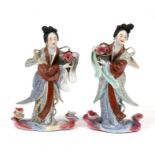 A pair of Chinese figures depicting robed ladies, with an impressed seal mark to the underside,