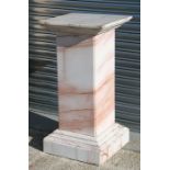 A figured white marble square form column on a stepped base, 50cms (19.75ins) wide.