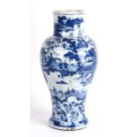 A 19th century Chinese kangxi style blue and white vase, decorated in slight relief with figures