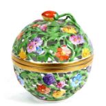 A Herend pierced porcelain potpourri box and cover decorated with flowers, 10cms (4ins) high.