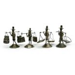 Four early 20th century silver figural menu holders, Wai Kee signature to the underside, 6.5cms (2.