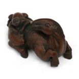A Chinese carved bamboo group depicting a recumbent horse with a monkey on his back, 9cms (3.5ins)