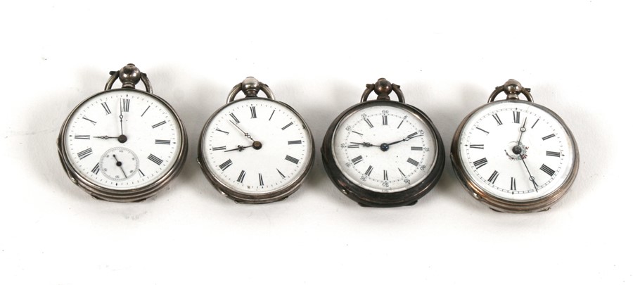 A group of four continental white metal cased open faced fob watches.