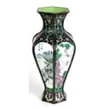 A Chinese enamel vase of hexagonal form decorated with birds, flowers and landscape scene with
