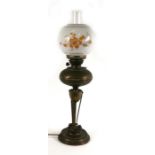 A brass oil lamp (converted to electricity), 66cms (26ins) high.