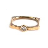 A 14ct gold modern design diamond solitaire ring, approx UK size 'H'.