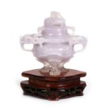 A Chinese lavender jade two-handled censer on three lion mask legs, 10cms (4ins) high.Condition
