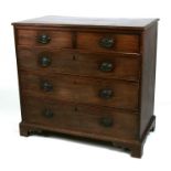 An early 19th century mahogany chest with four long graduated drawers, on bracket feet, 97cms (