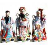 Three large Chinese porcelain House Gods, 20th century, Lu, Fu and Shou, the largest 41cm (16ins)