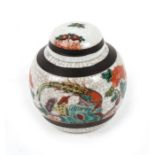 A Chinese crackle glaze ginger jar, decorated a bird and flowers, red seal mark to the underside.