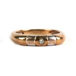 A 9ct gold ring set with a single diamond, approx UK size 'N'.