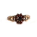 A 9ct gold garnet cluster ring, approx UK size 'P'.