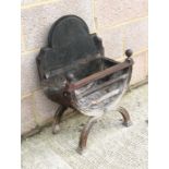A 19th century cast iron fire grate, 41cms (16ins) wide.