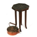 An Arts & Crafts carved walnut occasional table; together with a copper kettle (2).