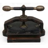 A Victorian cast iron book press, 44cms (17.25ins) wide.