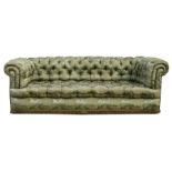A large button backed Chesterfield sofa, on bun feet, 230cms (90.5ins) wide.Condition Report Mouse