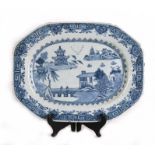 An 18th century Chinese blue & white meat dish decorated with a river landscape scene with two