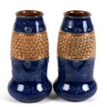 A pair of Doulton Lambeth Gilt Circle ware vases, 20cms (8ins) high.