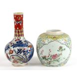 A Chinese Kangxi clobbered bottle vase decorated with butterflies and flowers, 19cms (7.5ins)