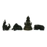 A small Chinese or Tibetan bronze Buddha, 7cms (2.275ins) high; together with three Chinese cast