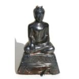 A silver overlay Thai Buddha seated in meditation, 13cms (5ins) high