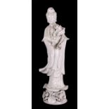 A Chinese Blanc de Chine figure depicting Guanyin, 46cms (18ins) high.