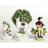 A small Staffordshire pottery figure; together with two Derby style figures, the largest 16cms (6.