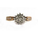 A 9ct gold diamond cluster ring, approx UK size 'I'.