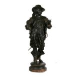 A large bronzed spelter figure in the form of a cavalier, 91cms (36ins) high.