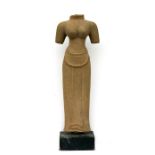 A large Cambodian Khmer sandstone figure, 81cms (32ins) high.