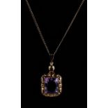 An 8ct gold amethyst pendant on an 8ct gold chain.Condition Report Total weight 6.8g.