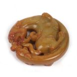 A Chinese figured jade carving in the form of two dragons, 5cms (2ins) diameter.