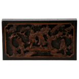 A pierced and carved Chinese hardwood plaque depicting dancing figures, 17cms (6.75ins) wide.