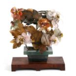 A Chinese gem tree on hardwood stand, 19cms (7.5ins) high.