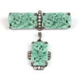 A silver mounted jade like glass pendant and matching brooch.