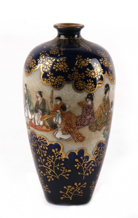 A 19th century Japanese Satsuma vase decorated with figures in a court scene, on a blue ground