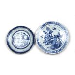 A Chinese blue & white plate decorated with a bird and butterflies amongst flowering foliage,