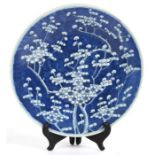 An antique Chinese cracked ice prunus decorated plate, 28cms (11ins) diameter.Condition Report