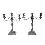 A pair of three-armed silver plated candelabra, 48cms (19ins) high.