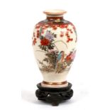 A late 19th century Japanese Satsuma vase decorated with birds and flowers, with gilt seal mark to