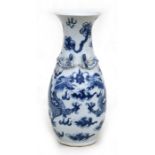 A Chinese blue & white vase decorated with dragons chasing a flaming pearl amongst clouds, with