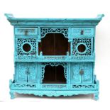 A 19th century Chinese cabinet with two short doors above a pierced gallery with cupboards