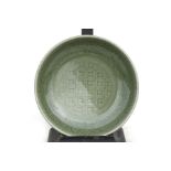 A Chinese Ming celadon glaze shallow dish, 23cms (9ins) diameter.Condition Report Very good