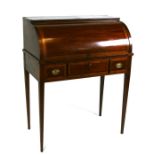 An early 20th century inlaid mahogany cylinder bureau of small proportion, the cylinder top