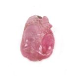 An antique Chinese carved pink tourmaline pendant in the form of gourds, 3.5cms (1.25ins) high.