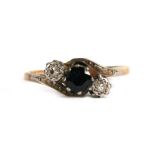 An 18ct gold diamond and sapphire ring, approx UK size 'N'.