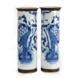 A pair of Chinese crackle glaze blue & white sleeve vases decorated with birds and flowers, four