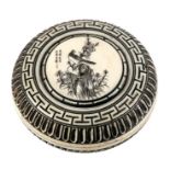 A Chinese ivory circular box decorated with a bird amongst foliage and calligraphy, 6.5cms (2.