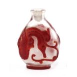 An antique Chinese overlaid glass snuff bottle, 6cms (2.25ins) high.
